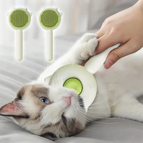 Cat being groomed with the Shedless self-cleaning brush