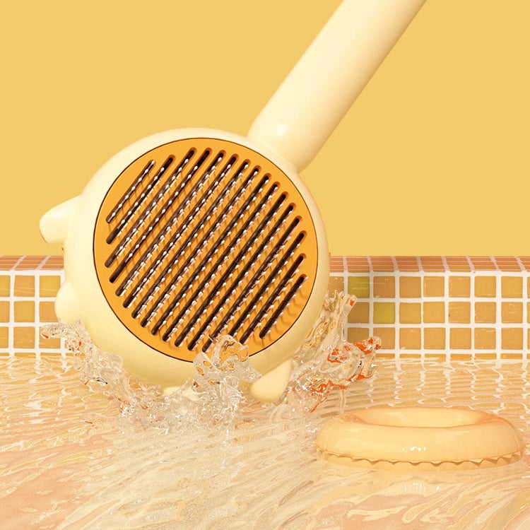 The brush head being rinsed under running water