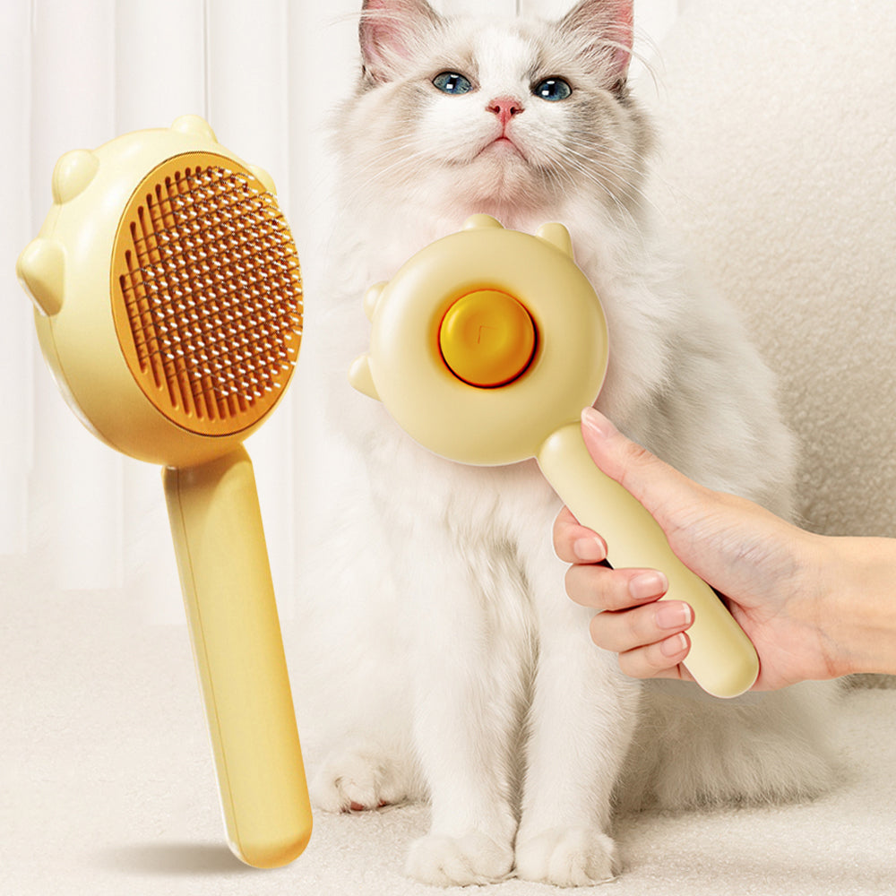 Shedless self-cleaning cat brush, front and back, held beside a longhaired cat