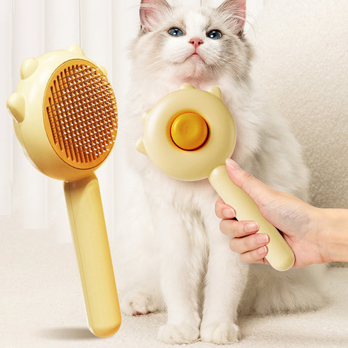 Shedless self-cleaning cat brush, front and back, held beside a longhaired cat